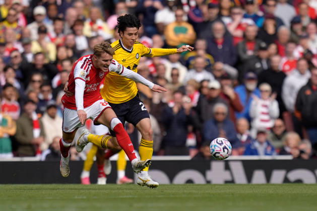 10th October 2026; Emirates Stadium, London, England; Premier League Football, Arsenal versus Leeds United; Martin Odegaard of Arsenal is challenged by Ao Tanaka of Leeds United TomxMajor