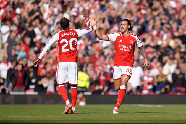 10th October 2026; Emirates Stadium, London, England; Premier League Football, Arsenal versus Leeds United; Riccardo Calafiori of Arsenal high fives Noni Madueke of Arsenal after scoring the equaliser to make it 1-1 in the 62nd minute TomxMajor