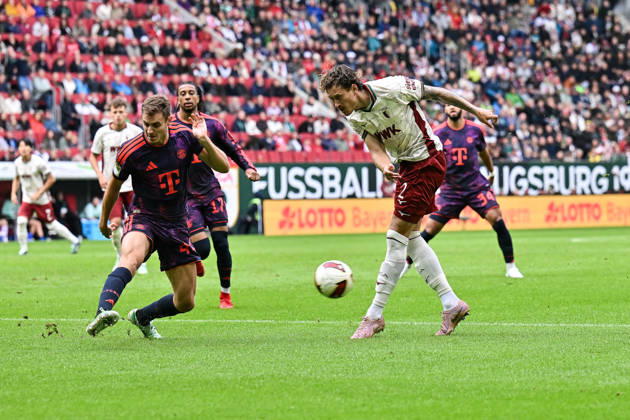 AUGSBURG, GERMANY; 10. OCTOBER: tackle between Josip STANISIC (FC Bayern Munich 44) and Calvin BRACKELMANN (FC Augsburg 2) during the Bundesliga Match between FC Augsburg vs. FC Bayern Munich at Matchday 5 at WWK-Arena DFL REGULATIONS PROHIBIT ANY USE OF PHOTOGRAPHS AS IMAGE SEQUENCES AND OR QUASI-VIDEO Copyright: xBEAUTIFULxSPORTS Goldbergx