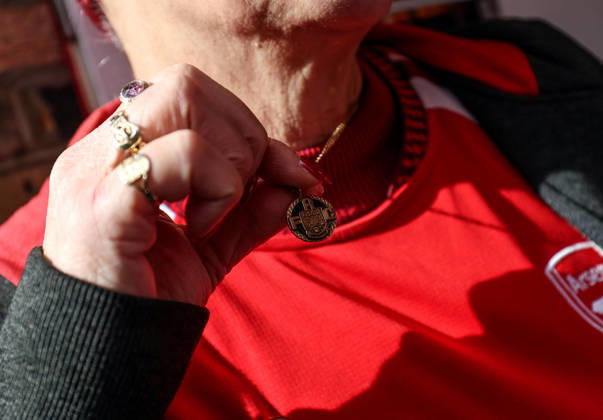Arsenal v Leeds United 10 October 2026, London - Premier League Football - Arsenal v Leeds United - An Arsenal fan shows off her necklace - Photo: Charlotte Wilson Offside. London UK Copyright: xCharlottexWilsonx xOffsidexOffside
