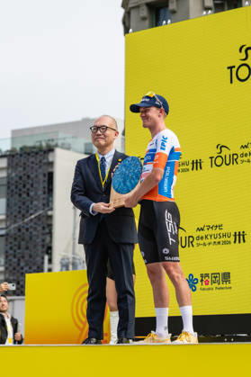 Tour De Kyushu Stage Finishes In Fukuoka s Tenjin For The First Time Matteo Malucelli of XDS Astana Team wins Stage 1 of the Mynavi Tour de Kyushu 2026 at the finish line on Tenjin Bridge in Fukuoka, Japan, on October 10, 2026. The Italian won the 152.0-kilometer Saga-Fukuoka stage in 3 hours 9 minutes 51 seconds, ahead of Luke Mudgway (Li Ning Star) and Alessio Delle Vedove (XDS Astana Team), and took the general and points classification leads. It was the first time the race finished in Tenjin, the commercial heart of Fukuoka, where a parade, stage events and food stalls marked the day. The race, first held in 2023 and part of the UCI Asia Tour (2.1 category), runs October 9-12 through six Kyushu prefectures under the official title We stand with Kumamoto. Mynavi Tour de Kyushu 2026, adopted to support areas affected by the Kumamoto earthquake. Fukuoka Japan Copyright: xRyoxChix originalFilename:zhi-tourdeky261010_npGhA.jpg