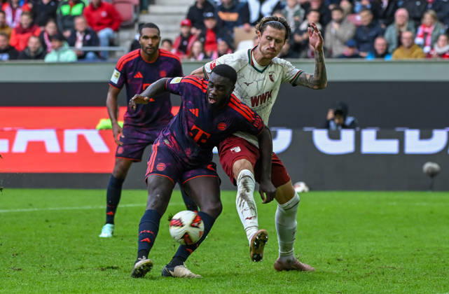 10.10.2026, xemx, Fussball 1.Bundesliga, FC Augsburg - Bayern München v.l. Dayot Upamecano (FC Bayern Muenchen), Calvin Brackelmann (FC Augsburg) Zweikampf, Aktion, action, battle for the ball (DFL DFB REGULATIONS PROHIBIT ANY USE OF PHOTOGRAPHS as IMAGE SEQUENCES and or QUASI-VIDEO) Augsburg