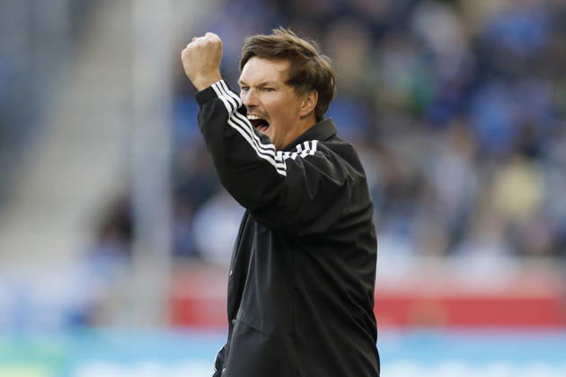 Trainer Merlin Polzin (HSV), Jubel , jubelnd, bejubelt, jubelt, jubeln, cheering, celebrated, cheers, cheering, emotions, Becker Faust im Bundesliga-Spiel zwischen der TSG 1899 Hoffenheim und dem Hamburger SV in der PreZero Arena, Sinsheim, Deutschland, am 10. Oktober 2026. in action during the Bundesliga match between TSG 1899 Hoffenheim and Hamburger SV at the PreZero Arena, Sinsheim, Germany, on October 10, 2026. DFB DFL REGULATIONS PROHIBIT ANY USE OF PHOTOGRAPHS AS IMAGE SEQUENCES AND OR QUASI-VIDEO, Copyright: HMBxMedia xHeikoxBecker