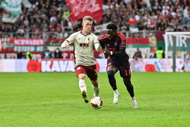 AUGSBURG, GERMANY; 10. OCTOBER: tackle between Anton KADE (FC Augsburg 30) und Alphonso DAVIES (FC Bayern Munich 19) during the Bundesliga Match between FC Augsburg vs. FC Bayern Munich at Matchday 5 at WWK-Arena DFL REGULATIONS PROHIBIT ANY USE OF PHOTOGRAPHS AS IMAGE SEQUENCES AND OR QUASI-VIDEO Copyright: xBEAUTIFULxSPORTS Goldbergx