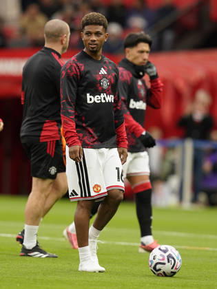 Manchester, England, 10th October 2026. Amad Diallo of Manchester United, ManU warms up during the Manchester United vs Tottenham Hotspur Premier League match at Old Trafford, Manchester. Picture credit should read: Andrew Yates Sportimage EDITORIAL USE ONLY. No use with unauthorised audio, video, data, fixture lists, club league logos or live services. Online in-match use limited to 120 images, no video emulation. No use in betting, games or single club league player publications. SPI_010_AY_MANUTD_SPURS SPI-5058-0011