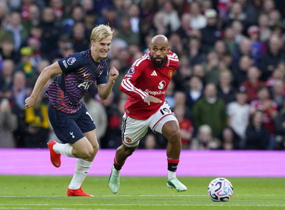 Manchester, England, 10th October 2026. Lucas Bergvall of Tottenham tussles with Bryan Mbeumo of Manchester United, ManU during the Manchester United vs Tottenham Hotspur Premier League match at Old Trafford, Manchester. Picture credit should read: Andrew Yates Sportimage EDITORIAL USE ONLY. No use with unauthorised audio, video, data, fixture lists, club league logos or live services. Online in-match use limited to 120 images, no video emulation. No use in betting, games or single club league player publications. SPI_019_AY_MANUTD_SPURS SPI-5058-0019