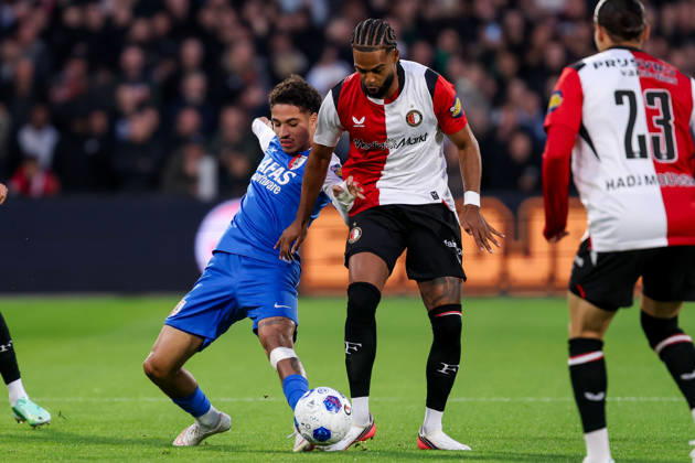 2026-10-10 Feyenoord v AZ Alkmaar - Dutch Eredivisie ROTTERDAM, NETHERLANDS - OCTOBER 10: Ro-Zangelo Daal of AZ Alkmaar battles for the ball with Jeremiah St. Juste of Feyenoord during the Dutch Eredivisie match between Feyenoord and AZ Alkmaar at Stadion Feijenoord on October 10, 2026 in Rotterdam, Netherlands. Rotterdam Stadion Feijenoord Netherlands Content not available for redistribution in The Netherlands directly or indirectly through any third parties. Copyright: xHansxvanxderxValkx