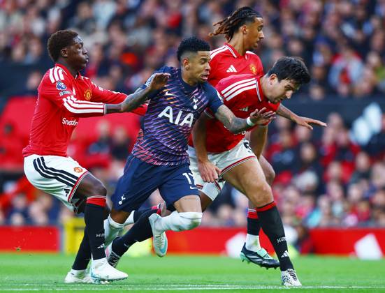 Savio of Tottenham Hotspur with Harry Maguire and Kobbie Mainoo of Manchester United, ManU Manchester United v Tottenham Hotspur, Premier League, Football, Old Trafford, Manchester, UK - 10 Oct 2026Manchester Old Trafford United Kingdom EDITORIAL USE ONLY No use with unauthorised audio, video, data, fixture lists, club league logos or live services. Online in-match use limited to 120 images, no video emulation. No use in betting, games or single club league player publications. Copyright: xMattxWest Shutterstockx 17208388q