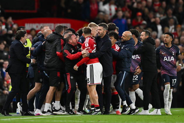 MANCHESTER, ENGLAND, OCT 10: Michael Carrick head coach of Manchester United, ManU pulls away Luke Shaw of Manchester United after Rodrigo Bentancur (Not pictured) of Tottenham Hotspur is sent off during the Premier League match between Manchester United and Tottenham Hotspur at Old Trafford in Manchester, England (Will Palmer Sports Press Photo) Copyright: xWillxPalmer SportsxPressxPhotox Sportspressphoto_SPR251439