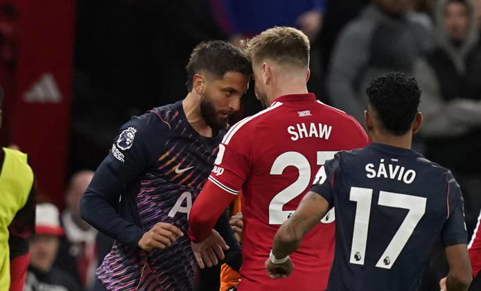 Manchester, England, 10th October 2026. Rodrigo Bentancur of Tottenham Hotspur (L) headsets Luke Shaw of Manchester United, ManU resulting in a red card during the Manchester United vs Tottenham Hotspur Premier League match at Old Trafford, Manchester. Picture credit should read: Andrew Yates Sportimage EDITORIAL USE ONLY. No use with unauthorised audio, video, data, fixture lists, club league logos or live services. Online in-match use limited to 120 images, no video emulation. No use in betting, games or single club league player publications. SPI_045_AY_MANUTD_SPURS SPI-5058-0045