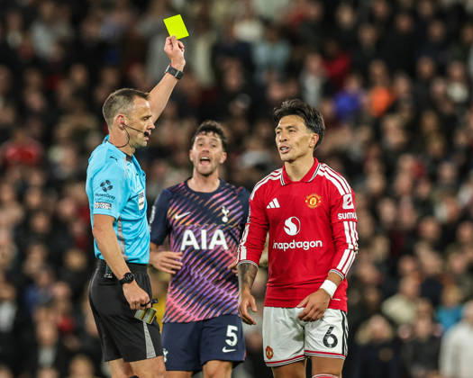 Premier League: Manchester United, ManU v Tottenham Hotspur Referee Stuart Attwell gives a yellow card to Lisandro Martinez of Manchester United during the Premier League match Manchester United vs Tottenham Hotspur at Old Trafford, Manchester, United Kingdom on 10 October 2026 (Photo by Mark Cosgrove News Images) Manchester Old Trafford Greater Manchester United Kingdom Copyright: xMarkxCosgrove NewsxImagesx