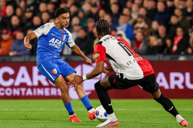 2026-10-10 Feyenoord v AZ Alkmaar - Dutch Eredivisie ROTTERDAM, NETHERLANDS - OCTOBER 10: Ayoub Oufkir of AZ Alkmaar is challenged by Jeremiah St. Juste of Feyenoord during the Dutch Eredivisie match between Feyenoord and AZ Alkmaar at Stadion Feijenoord on October 10, 2026 in Rotterdam, Netherlands. Rotterdam Stadion Feijenoord Netherlands Content not available for redistribution in The Netherlands directly or indirectly through any third parties. Copyright: xHansxvanxderxValkx