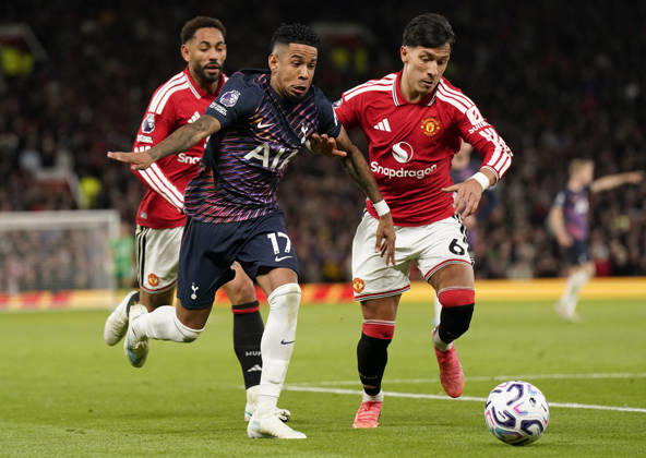Manchester, England, 10th October 2026. Savio of Tottenham Hotspur (L) is challenged by Lisandro Martinez of Manchester United, ManU during the Manchester United vs Tottenham Hotspur Premier League match at Old Trafford, Manchester. Picture credit should read: Andrew Yates Sportimage EDITORIAL USE ONLY. No use with unauthorised audio, video, data, fixture lists, club league logos or live services. Online in-match use limited to 120 images, no video emulation. No use in betting, games or single club league player publications. SPI_055_AY_MANUTD_SPURS SPI-5058-0055