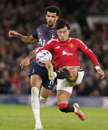 Manchester, England, 10th October 2026. Dominic Solanke of Tottenham Hotspur (L) is challenged by Lisandro Martinez of Manchester United, ManU during the Manchester United vs Tottenham Hotspur Premier League match at Old Trafford, Manchester. Picture credit should read: Andrew Yates Sportimage EDITORIAL USE ONLY. No use with unauthorised audio, video, data, fixture lists, club league logos or live services. Online in-match use limited to 120 images, no video emulation. No use in betting, games or single club league player publications. SPI_068_AY_MANUTD_SPURS SPI-5058-0068