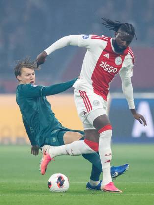 AMSTERDAM , 10-09-2026 , JohanCruyff Arena , season 2026 2027 , Dutch Eredivisie football , Match between Ajax and NEC Nijmegen , picture shows NEC Nijmegen player Perr Schuurs challenges Ajax player Tolu Arokodare Ajax - NEC  x208125190x Copyright: