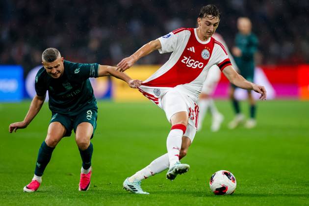 AMSTERDAM , 10-10-2026 , JohanCruyff Arena , season 2026 2027 , Dutch Eredivisie football , Match between Ajax and NEC Nijmegen , picture shows NEC Nijmegen player Bryan Linssen challenges Ajax player Youri Baas Ajax - NEC  x208127209x Copyright: