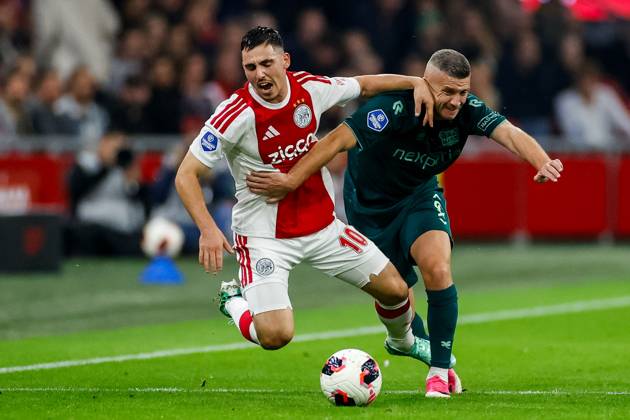 AMSTERDAM , 10-10-2026 , JohanCruyff Arena , season 2026 2027 , Dutch Eredivisie football , Match between Ajax and NEC Nijmegen , picture shows Ajax player Oscar Gloukh and NEC Nijmegen player Bryan Linssen battle for the ball Ajax - NEC  x208128115x Copyright: