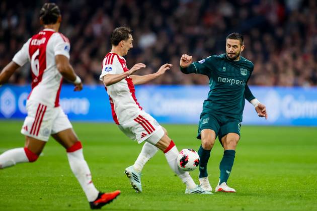 AMSTERDAM , 10-10-2026 , JohanCruyff Arena , season 2026 2027 , Dutch Eredivisie football , Match between Ajax and NEC Nijmegen , picture shows Ajax player Youri Baas and NEC Nijmegen player Dusan Tadic battle for the ball Ajax - NEC  x208128117x Copyright: