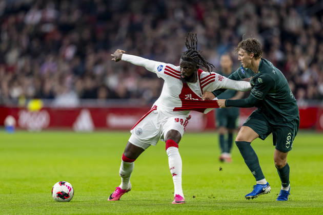 AMSTERDAM - (l-r) AFC Ajax Amsterdam forward Toluwalase Arokodare and N.E.C. Nijmegen defender Perr Schuurs during the Vriendenloterij Eredivisie match between Ajax and N.E.C. at Johan Cruijff ArenA on 10 oktober 2026 in Amsterdam , Nederland. (Photo by DeFodi Images) -