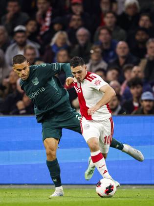 AMSTERDAM - (lr) Gabriel Bras of NEC Nijmegen, Oscar Gloukh of Ajax during the Dutch Eredivisie match between AFC Ajax and NEC Nijmegen at the Johan Cruijff ArenA on October 10, 2026 in Amsterdam, the Netherlands. MAURICE VAN STEEN ANP Eredivisie 2026 27 xVIxANPxSportx xxANPxIVx 572064834 originalFilename: 572064834
