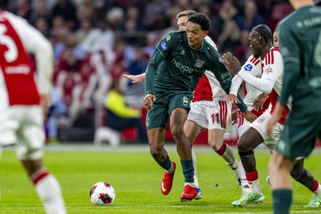 AMSTERDAM - (l-r) N.E.C. Nijmegen defender Kevin Kers and AFC Ajax Amsterdam defender Jorthy Mokio during the Vriendenloterij Eredivisie match between Ajax and N.E.C. at Johan Cruijff ArenA on 10 October 2026 in Amsterdam, Netherlands. (Photo by DeFodi Images) -