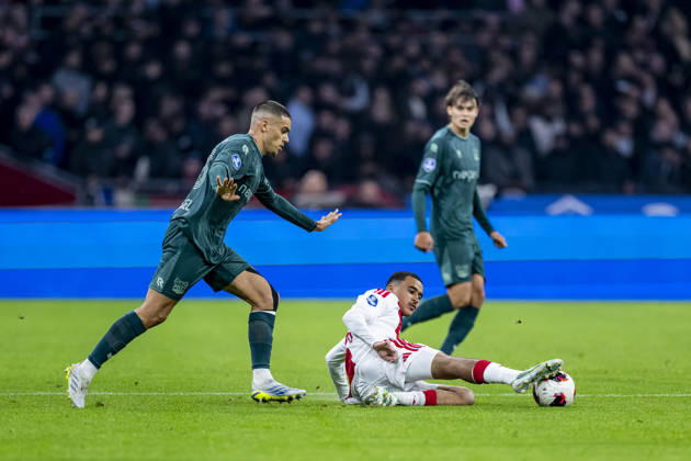 AMSTERDAM - (l-r) N.E.C. Nijmegen defender Gabriel Bras and AFC Ajax Amsterdam midfielder Abdellah Ouazane during the Vriendenloterij Eredivisie match between Ajax and N.E.C. in Johan Cruijff ArenA on 10 October 2026 in Amsterdam, Netherlands. (Photo by DeFodi Images) -