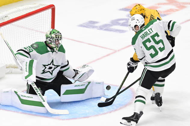 Dallas Stars goaltender Jake Oettinger (29) makes the safe as Dallas Stars defenseman Thomas Harley (55) and Pittsburgh Penguins center Sidney Crosby (87) waits for the rebound during the second period at PPG Paints Arena in Pittsburgh on Saturday, October, 10 2026.  PIT2026101006 ARCHIExCARPENTER