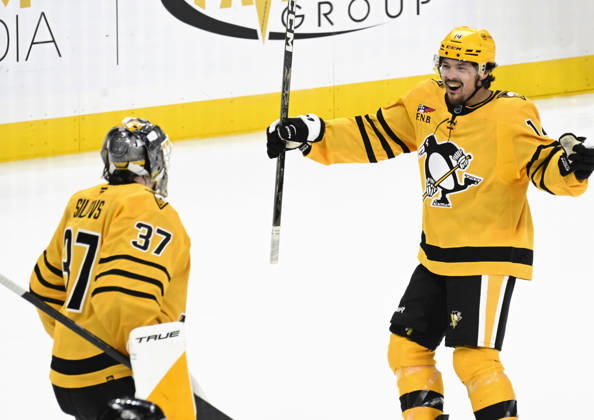 Pittsburgh Penguins left wing Nick Robertson (14) skates in to celebrates the 2-1 shootout win against the Dallas Stars with Pittsburgh Penguins goaltender Arturs Silovs (37) at PPG Paints Arena in Pittsburgh on Saturday, October, 10 2026.  PIT2026101011 ARCHIExCARPENTER