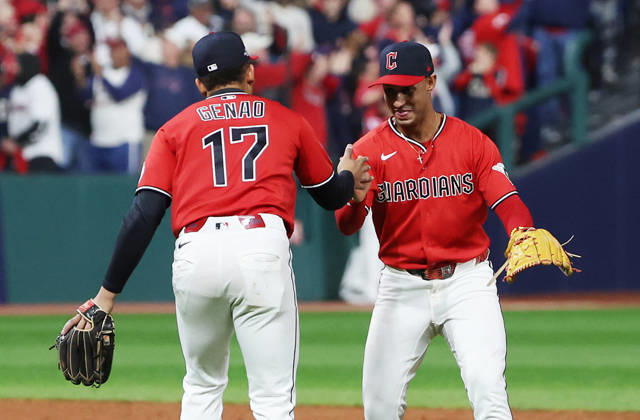 Cleveland Guardians second baseman Angel Genao (17) and shortstop Brayan Rocchio (4) celebrate after the Guardians defeated the Chicago White Sox 2-0 in the final game of their MLB, Baseball Herren, USA American League Division Series at Progressive Field in Cleveland, Ohio, on Saturday, October 10, 2026. The Guardians advance to play the Tampa Bay Rays in the American League Championship Series.  CLE20261010740 AARONxJOSEFCZYK