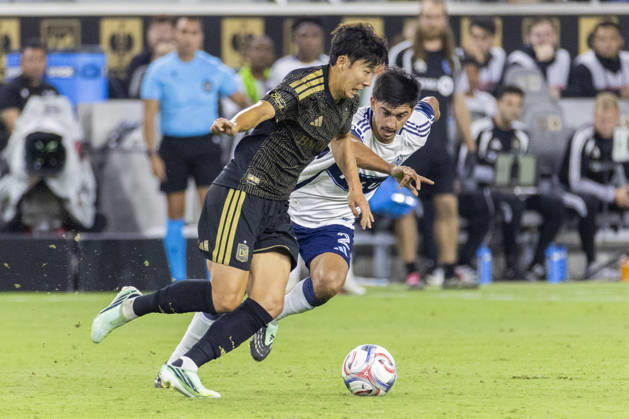 October 10, 2026, Los Angeles, California, USA: Los Angeles FC attacking midfielder Heung Min Son (7) and Vancouver Whitecaps centre back Mathias Laborda (2) vie for the ball during a MLS, Fussball Herren, USA soccer game on Saturday, Oct. 10, 2026 in Los Angeles. Los Angeles USA - ZUMAc68_ 20261010_zaf_c68_034 Copyright: xRingoxChiux