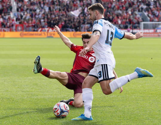 (261011) -- TORONTO, Oct. 11, 2026 -- Alonso Coello (L) of Toronto FC vies with Luca Petrasso of CF Montreal during the 2026 Major League Soccer MLS, Fussball Herren, USA regular season match between Toronto FC and CF Montreal at BMO Field in Toronto, Canada, on Oct. 10, 2026. (Photo by Xinhua) (SP)CANADA-TORONTO-SOCCER-MLS-TORONTO FC VS CF MONTREAL ZouxZheng 