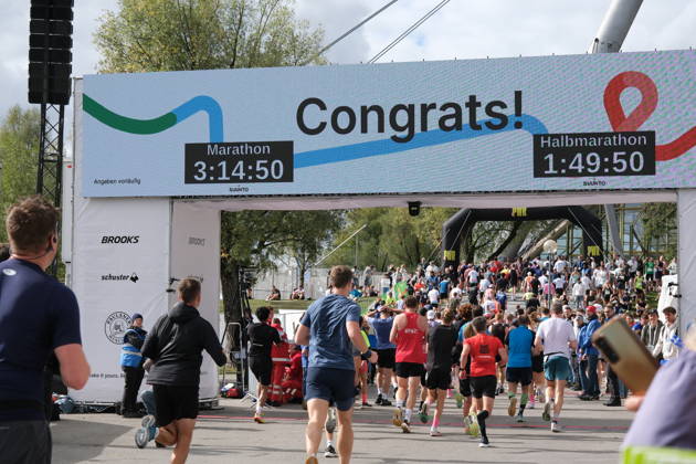 Munich Marathon 2026 MUNICH, GERMANY - OCTOBER 11: Runners cross the finish line under a large digital scoreboard displaying congratulations and race times during the 2026 Munich Marathon in Munich, Germany on October 11, 2026. The finish line is located in the Olympic Park, where the course both starts and ends. Merve Goettl Anadolu Munih Germany. Editorial use only. Please get in touch for any other usage.  Copyright: x2026xAnadoluxMervexGoettlx