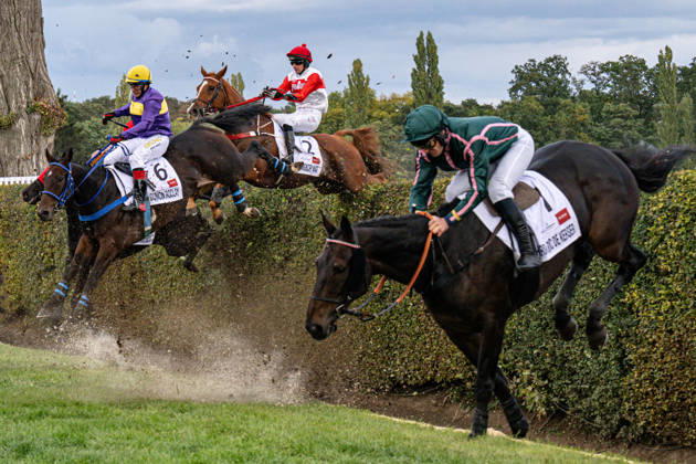 The 136th Grand Pardubice Steeplechase (6,900m), in Pardubice, Czech Republic, on October 11, 2026. The horses are crossing the Taxis Ditch. From left: Marcel Novak on Dumon Roclay, Jan Odlozil on Angkor Wat, and Jean-Stephane Lebrun on Hard Roc de Kerser clearing the Taxis Ditch. (CTKxPhoto DavidxTanecek) CTKPhotoP2026101104937  CTKPhotoP2026101104937