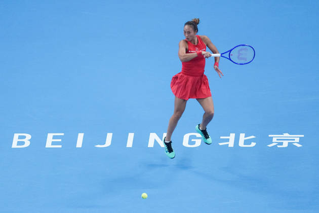 (261011) -- BEIJING, Oct. 11, 2026 -- Zheng Qinwen hits a return during the women s singles final between Zheng Qinwen of China and Mirra Andreeva of Russia at 2026 China Open tennis tournament in Beijing, China, Oct. 11, 2026. ) (SP)CHINA-BEIJING-TENNIS-CHINA OPEN-WOMEN S SINGLES-FINAL (CN) JuxHuanzong