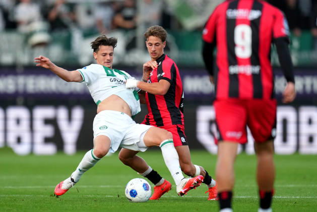 Eredivisie: Excelsior Rotterdam v FC Groningen Rotterdam - Tika de Jonge of FC Groningen duels for the ball with Lennard Hartjes of Excelsior Rotterdam during the eight competition round of the 2026 2027 Eredivisie season. The match is set between Excelsior Rotterdam and FC Groningen at Stadion Woudestein on 11 October 2026 in Rotterdam, Netherlands. (Hero Images Yannick Verhoeven) Copyright: xYannickxVerhoevenx