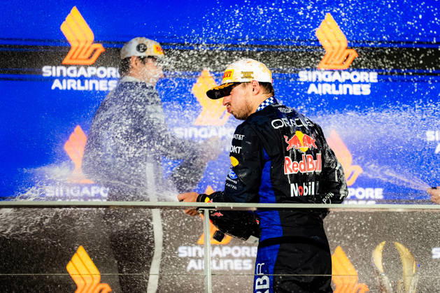 2026 Formula 1 Singapore Grand Prix - Podium CHARLES LECLERC 16 (MON) of Scuderia Ferrari HP (Ferrari SF-26) and MAX VERSTAPPEN 1 (NED) of Oracle Red Bull Racing (Red Bull Racing RB22) champagne celebration on the podium on Sunday Race Day during the Formula 1 Singapore Airlines Singapore Grand Prix 2026 at Marina Bay Street Circuit, Singapore, on October 11, 2026. Photo by Antoine Lapeyre Reveries Agency via ABACAPRESS.COM Singapore Singapore Copyright: xAntoinexLapeyre ReveriesxAgency ABACAx