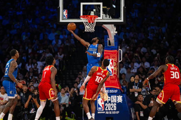 (261011) -- MACAO, Oct. 11, 2026 -- Kyrie Irving (top) of Dallas Mavericks goes for a layup during the 2026-2027 NBA, Basketball Herren, USA preseason game between Dallas Mavericks and Houston Rockets in Macao, south China, on Oct. 11, 2026. ) (SP)CHINA-MACAO-BASKETBALL-NBA PRESEASON-ROCKETS VS MAVERICKS (CN) CheongxKamxKa 