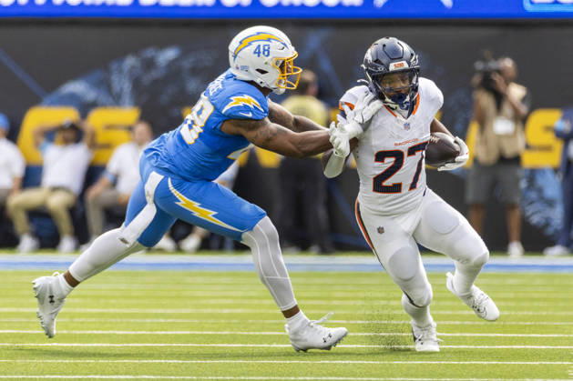 October 11, 2026, Inglewood, California, USA: Denver Broncos Running Back J.K. Dobbins (27) escapes a tackle-attempt by Los Angeles Chargers outside linebacker Bud Dupree (48) during an NFL, American Football Herren, USA football game, in Inglewood, Calif. on Sunday Oct. 11, 2026. Inglewood USA - ZUMAc68_ 20261011_zaf_c68_008 Copyright: xRingoxChiux