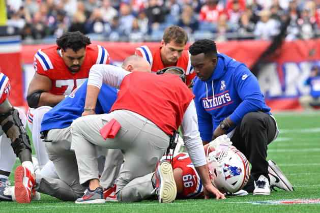 Oct 11, 2026; Foxborough, MA, USA; New England Patriots offensive tackle Will Campbell (66) is checked by training staff and head coach Mike Vrabel (red vest) during the first half against the Las Vegas Raiders at Gillette Stadium. Mandatory Credit: -Cal Media Foxborough USA - ZUMAc04_ 20261011_zma_c04_142 Copyright: xEricxCanhax