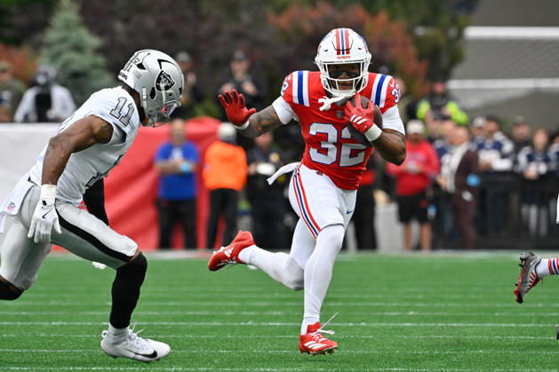 Oct 11, 2026; Foxborough, MA, USA; New England Patriots running back TreVeyon Henderson (32) runs the ball against Las Vegas Raiders safety Jeremy Chinn (11) during the first half at Gillette Stadium. Mandatory Credit: -Cal Media Foxborough USA - ZUMAc04_ 20261011_zma_c04_150 Copyright: xEricxCanhax