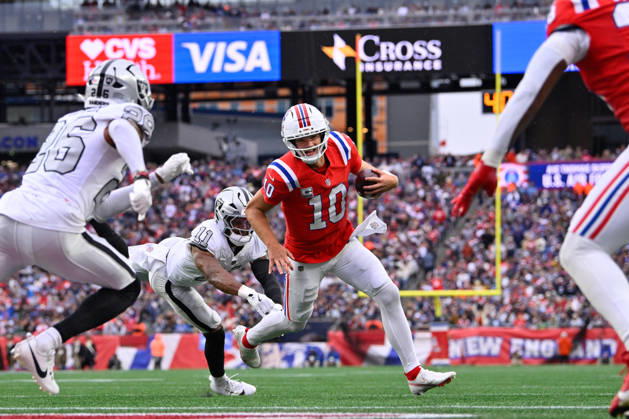 Oct 11, 2026; Foxborough, MA, USA; New England Patriots quarterback Drake Maye (10) avoids a tackle by Las Vegas Raiders safety Jeremy Chinn (11) and runs for a touchdown during the second half at Gillette Stadium. Mandatory Credit: -Cal Media Foxborough USA - ZUMAc04_ 20261011_zma_c04_155 Copyright: xEricxCanhax