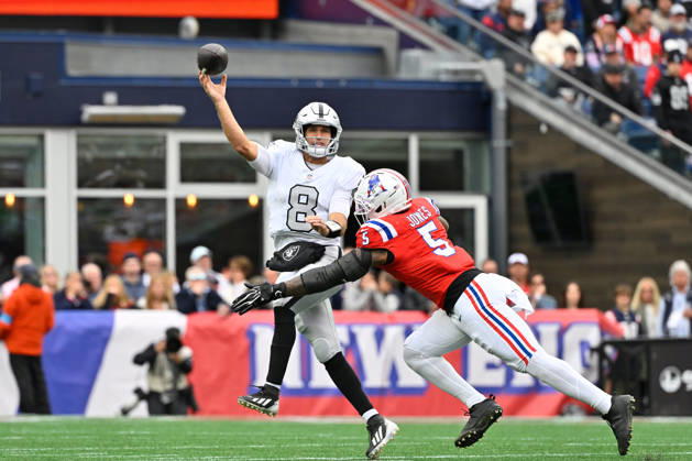 Oct 11, 2026; Foxborough, MA, USA; Las Vegas Raiders quarterback Kirk Cousins (8) throws a pass with pressure fro Las Vegas Raiders cornerback Eric Stokes (5) during the first half at Gillette Stadium. Mandatory Credit: -Cal Media Foxborough USA - ZUMAc04_ 20261011_zma_c04_161 Copyright: xEricxCanhax
