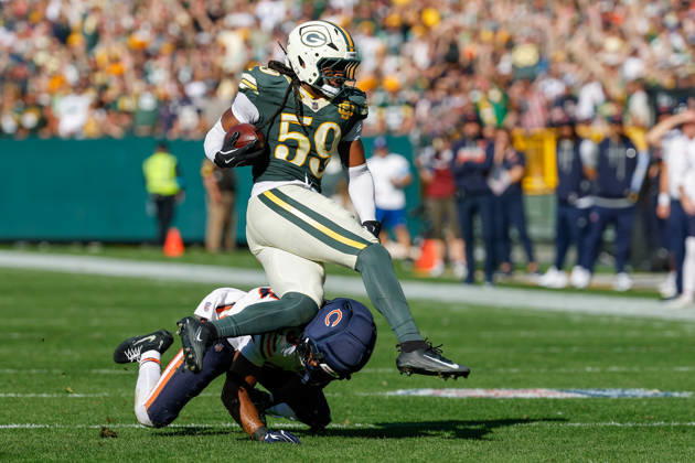 Oct 11, 2026; Green Bay, WI, USA; Green Bay Packers linebacker Ty ron Hopper (59) is tackled after making a interception during NFL, American Football Herren, USA game action against the Chicago Bears at Lambeau Field. Mandatory Credit: -Cal Media NFL 2026: Bears Vs Packers OCT 11  - ZUMAc04_ 20261011_zma_c04_231 Copyright: xDarrenxLeex