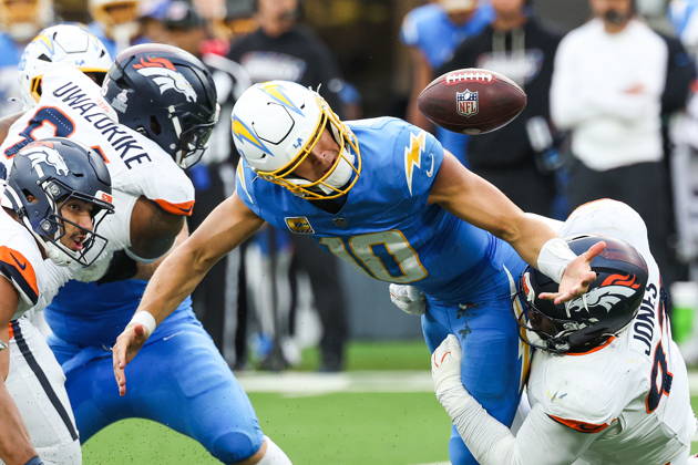 NFL, American Football Herren, USA - Los Angeles Chargers vs Denver Broncos Los Angeles Chargers quarterback Justin Herbert (10) recovers the football after fumbling during a sack by Denver Broncos defensive tackle D.J. Jones (93) in the second half of an NFL football game at SoFi Stadium in Inglewood, California, USA, 11 October 2026. INGLEWOOD CALIFORNIA UNITED STATES  Copyright: xCHRISxTORRESx
