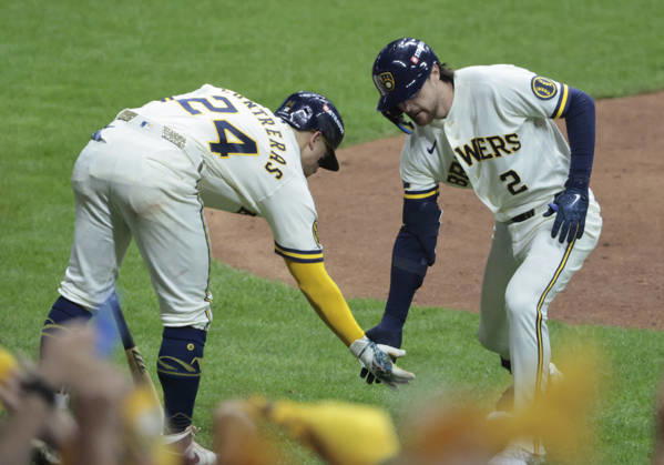 Milwaukee Brewers Brice Turang (2) celebrates with William Contreras (24) after hitting a solo home run against the Los Angeles Dodgers in the fourth inning of an MLB, Baseball Herren, USA National League Championship Series playoff game at American Family Field in Milwaukee, Wisconsin, on Sunday, October 11, 2026.  MIL20261011712 TANNENxMAURY