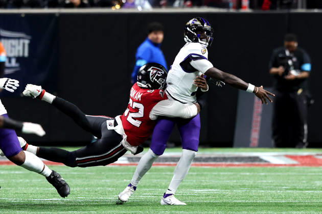 ATLANTA, GA - OCTOBER 11: Samson Ebukam (52) of the Atlanta Falcons hits quarterback Tyler Huntley (5) of the Baltimore Ravens as he relases a pass during the Sunday evening NFL, American Football Herren, USA game between the Atlanta Falcons and the Baltimore Ravens on October 11, 2026 at the Mercedes-Benz Stadium in Atlanta, Georgia. (Photo by David J. Griffin Icon Sportswire) NFL: OCT 11 Ravens at Falcons EDITORIAL USE ONLY Icon9532610110706