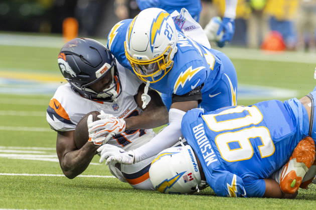 October 11, 2026, Inglewood, California, USA: Denver Broncos Wide Receiver Marvin Mims Jr. (19) is brought down by Los Angeles Chargers defensive lineman Nick Barrett (91) and safety RJ Mickens (27) during an NFL, American Football Herren, USA football game, in Inglewood, Calif. on Sunday Oct. 11, 2026. Inglewood USA - ZUMAc68_ 20261011_zaf_c68_125 Copyright: xRingoxChiux