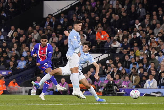 Manchester, England, 14th October 2026. Desire Doue of Paris Saint-Germain scores the first goal during the Manchester City vs Paris Saint Germain UEFA Champions League match at the Etihad Stadium, Manchester. Picture credit should read: Andrew Yates Sportimage EDITORIAL USE ONLY. No use with unauthorised audio, video, data, fixture lists, club league logos or live services. Online in-match use limited to 120 images, no video emulation. No use in betting, games or single club league player publications. SPI_019_AY_Man_City_PSG SPI-5069-0019