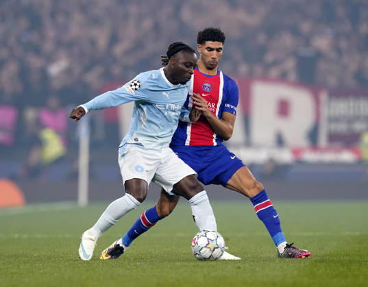 Manchester, England, 14th October 2026. Antoine Semenyo of Manchester City held up by Achraf Hakimi of Paris Saint-Germain during the Manchester City vs Paris Saint Germain UEFA Champions League match at the Etihad Stadium, Manchester. Picture credit should read: Andrew Yates Sportimage EDITORIAL USE ONLY. No use with unauthorised audio, video, data, fixture lists, club league logos or live services. Online in-match use limited to 120 images, no video emulation. No use in betting, games or single club league player publications. SPI_020_AY_Man_City_PSG SPI-5069-0020