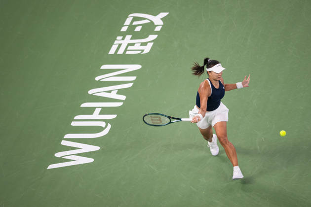 (261015) -- WUHAN, Oct. 15, 2026 -- Guo Hanyu returns a shot during the women s sinlges round of 16 match between Guo Hanyu of China and Elina Svitolina of Ukraine at the 2026 Wuhan Open tennis tournament in Wuhan, capital of central China s Hubei Province, Oct. 15, 2026. ) (SP)CHINA-WUHAN-TENNIS-WUHAN OPEN-WOMEN S SINGLES(CN) XiaoxYijiu 
